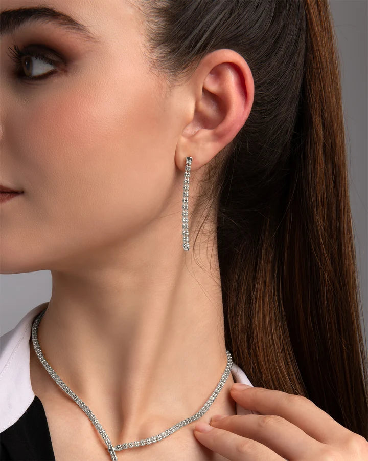 Orecchini Desmos in argento dorato a cascata con chicchi